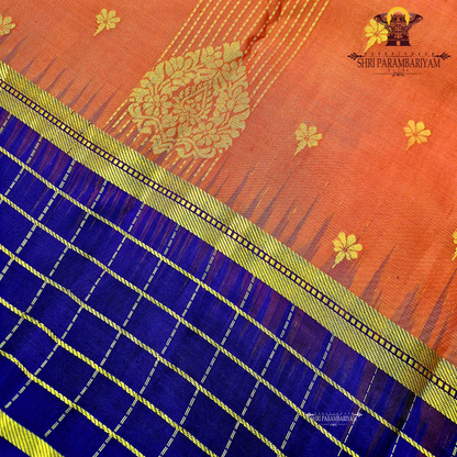 A striking reddish-orange (rust orange) Saree