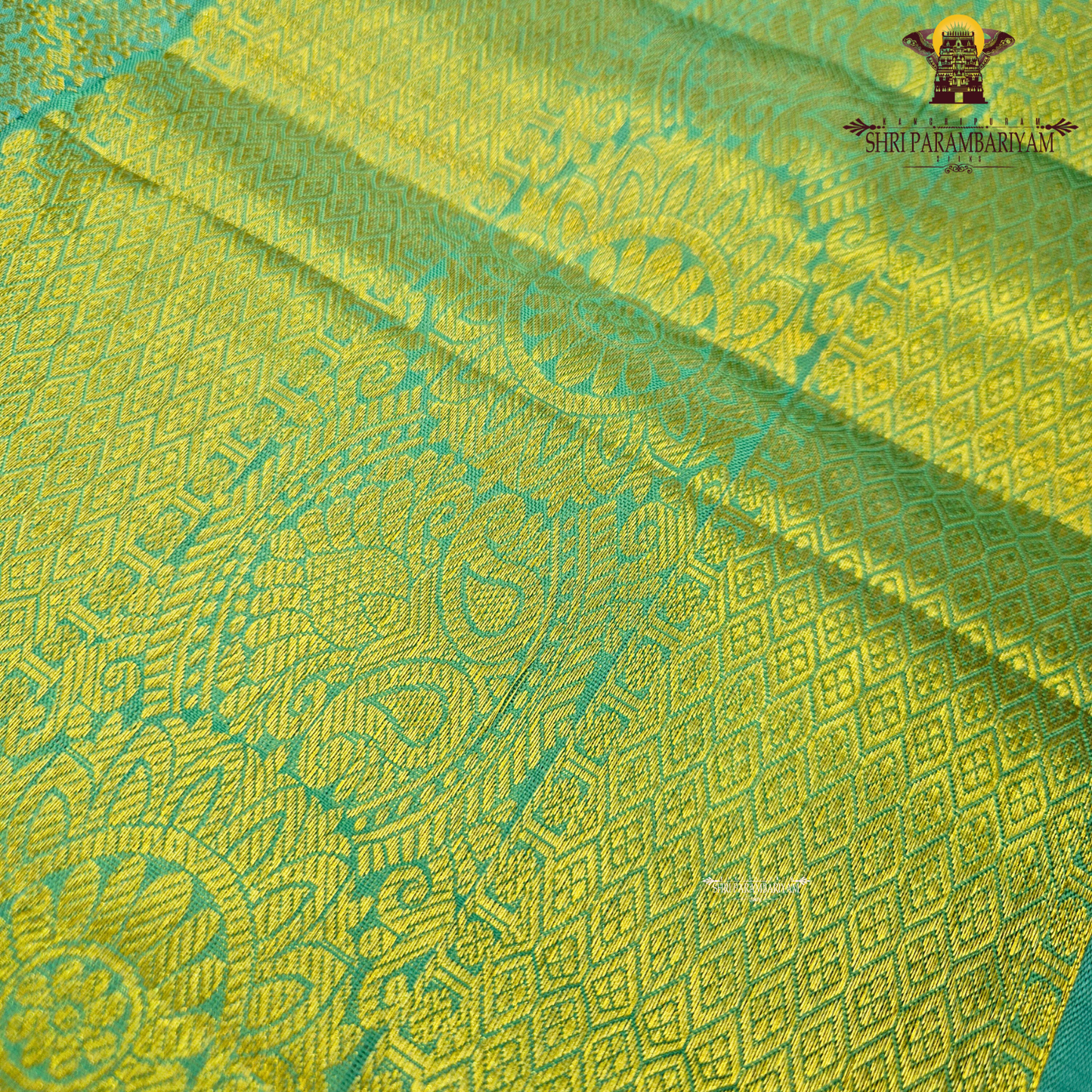 Bright Rani Pink body with a contrasting Peacock Blue / Aqua Green Saree