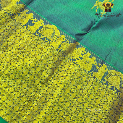 A elegant Dual-tone Teal Green with Royal Blue and Antique Gold Zari Saree