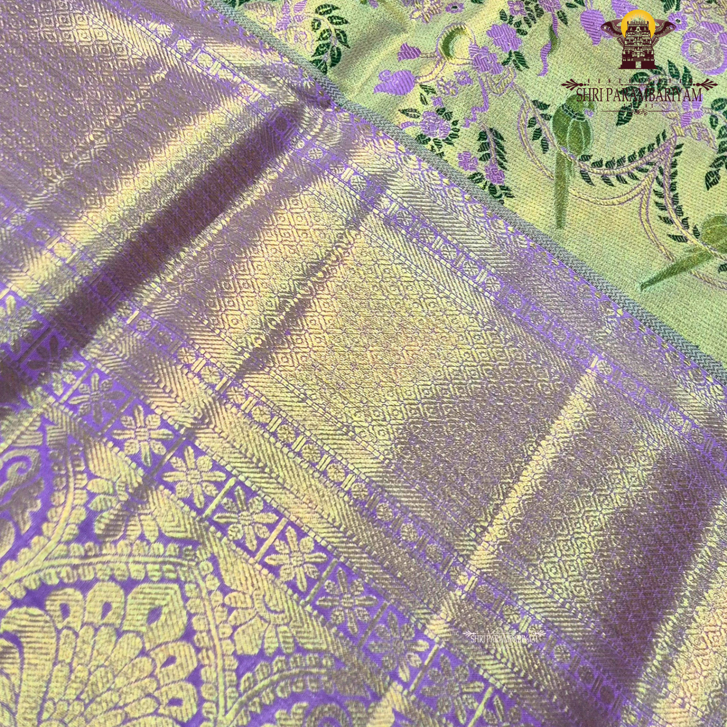 A graceful dual-tone combination of pastel pista green and soft lavender purple Saree