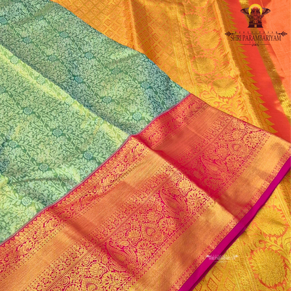 A refreshing pastel pista green body with a subtle sheen Saree