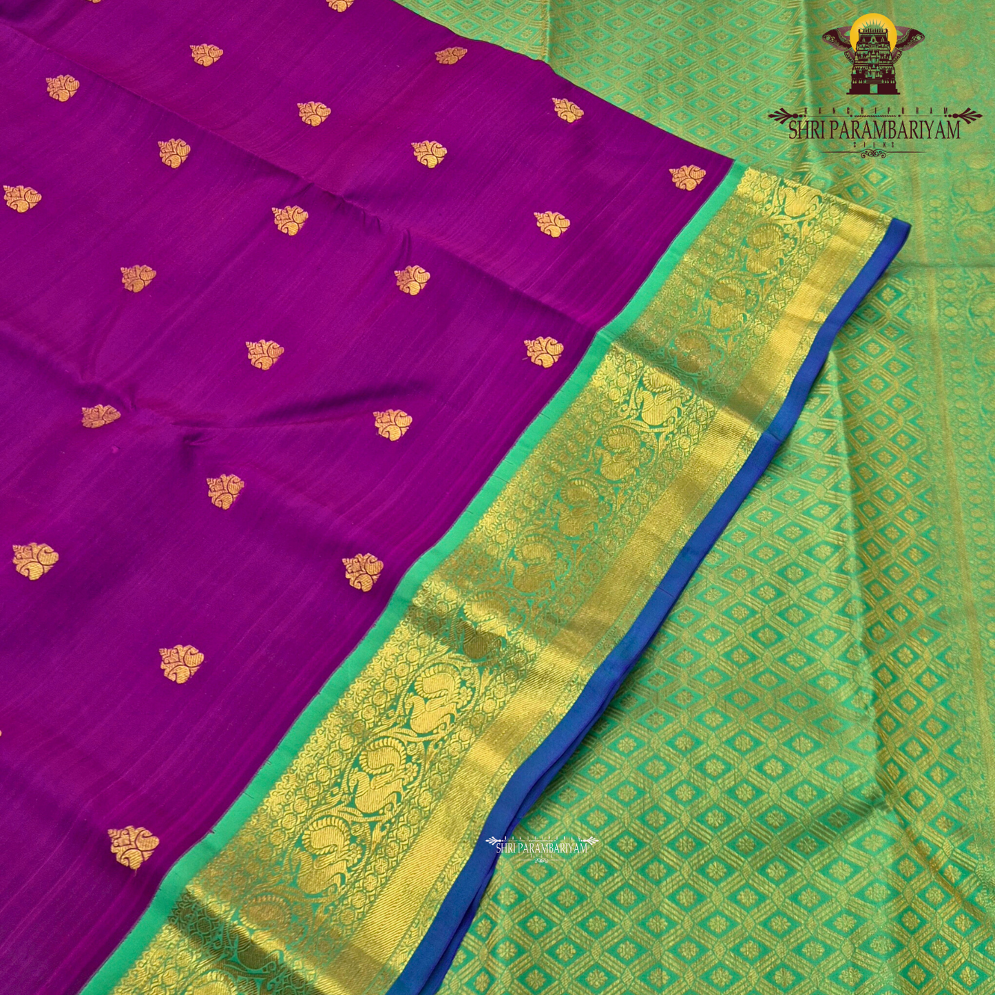 A rich royal purple body paired with a parrot green border highlighted Saree