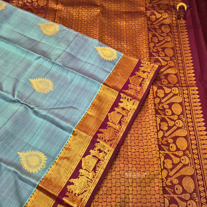 A elegant steel grey with rich gold zari border and contrast maroon/purple edging Saree