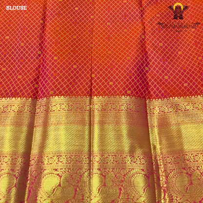 A vibrant reddish orange and pink combination with a radiant gold zari Saree