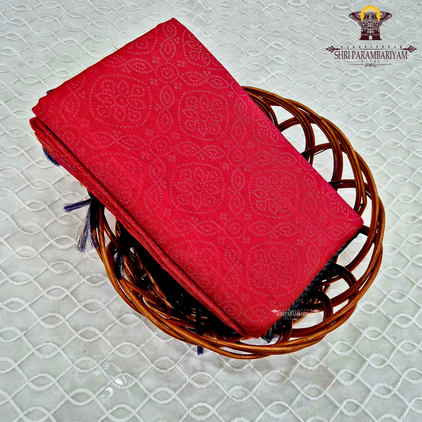 Vibrant ruby red with self-woven tonal motifs Saree