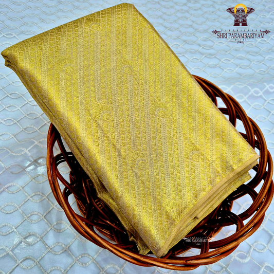 A radiant golden yellow shade that gives a rich and elegant Saree