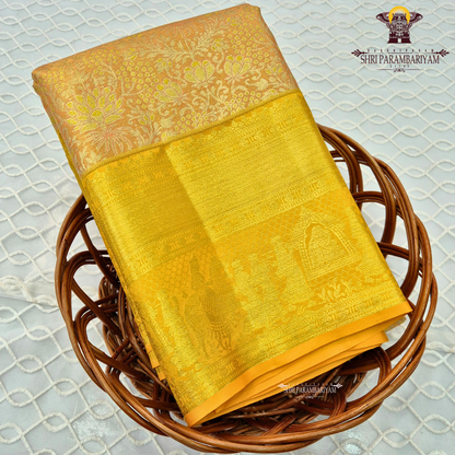 Soft peach / pastel orange with golden yellow (zari gold) border Saree