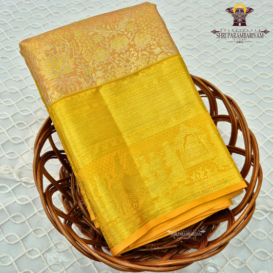 Soft peach / pastel orange with golden yellow (zari gold) border Saree