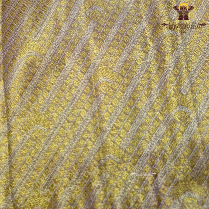A radiant golden yellow shade that gives a rich and elegant Saree