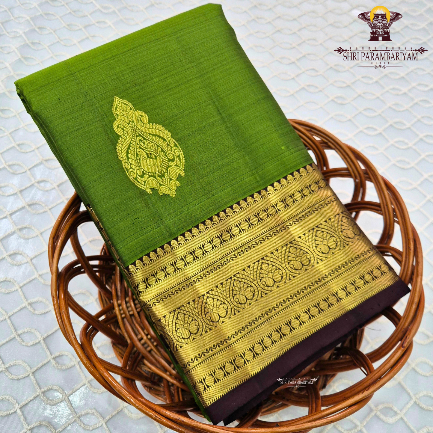 A rich Parrot Green (fresh leaf green tone) with a rich Gold zari Saree