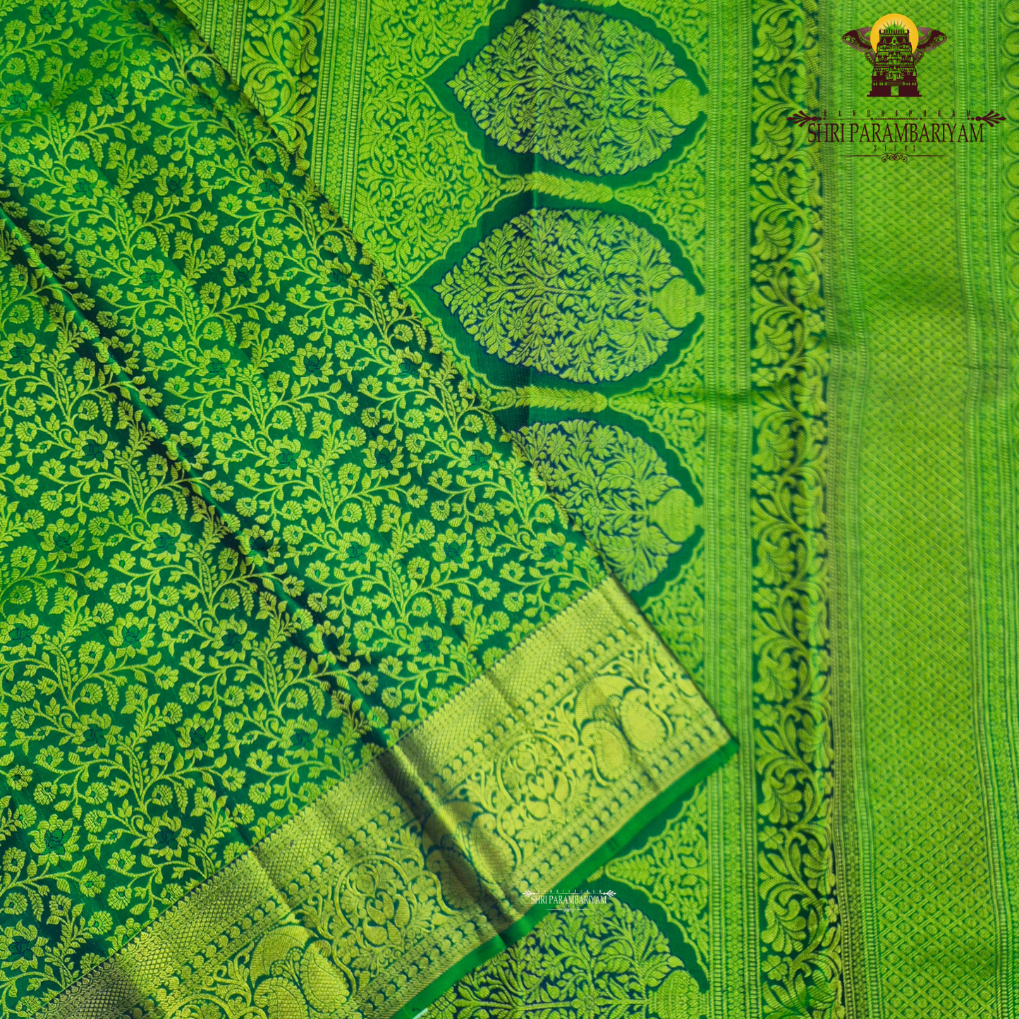 A beautiful emerald green and royal blue combination with rich gold zari Saree