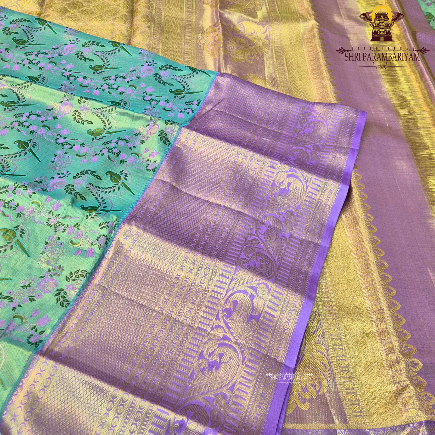 A refreshing dual-tone of mint green (pista green) and soft lavender purple Saree