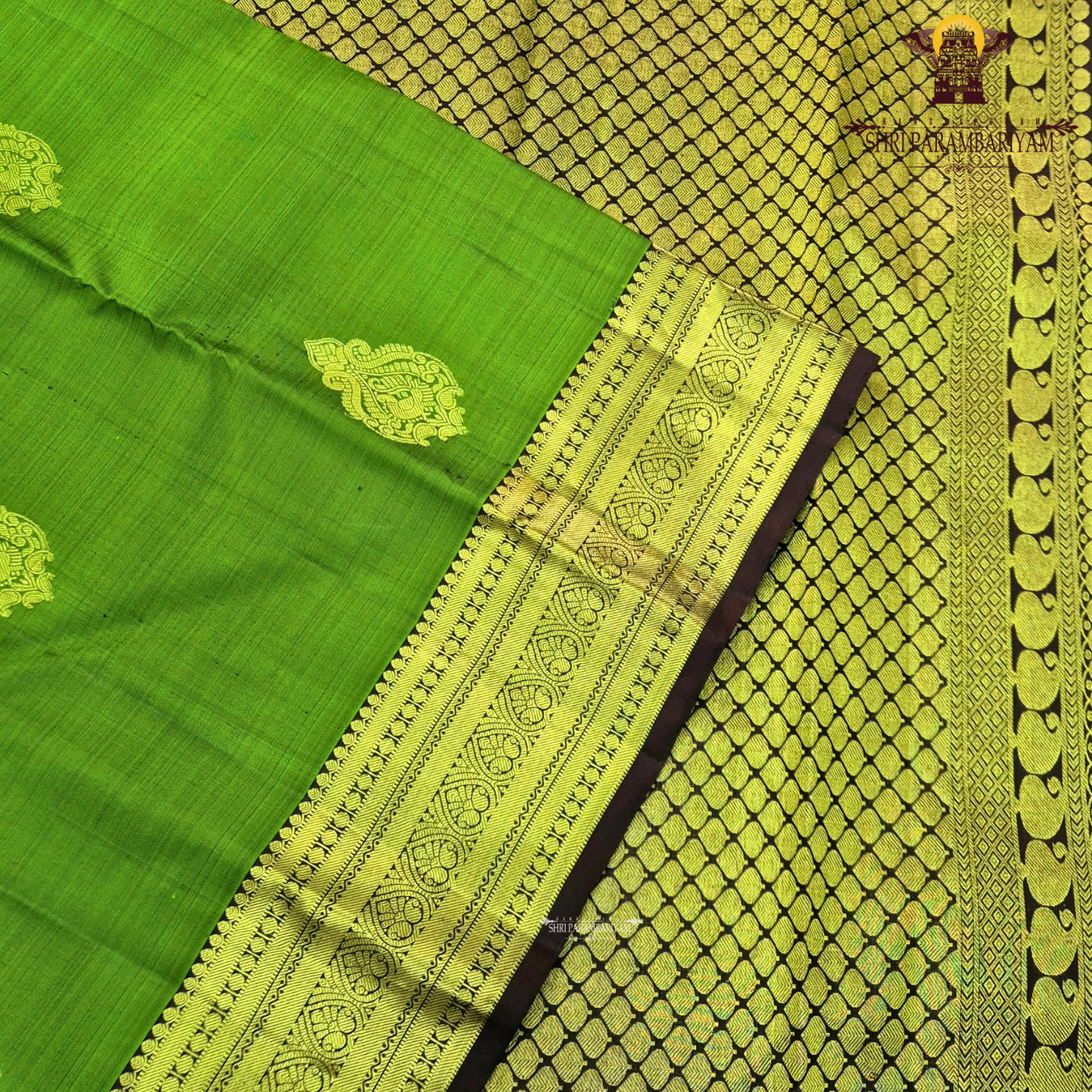 A rich Parrot Green (fresh leaf green tone) with a rich Gold zari Saree