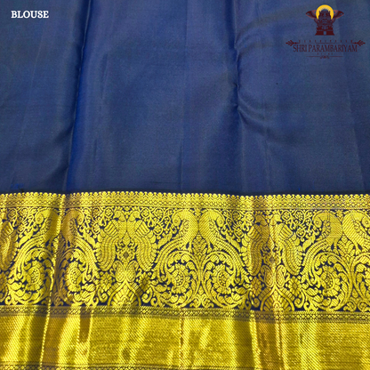 A bright parrot green body paired with a royal navy blue border richly woven Saree