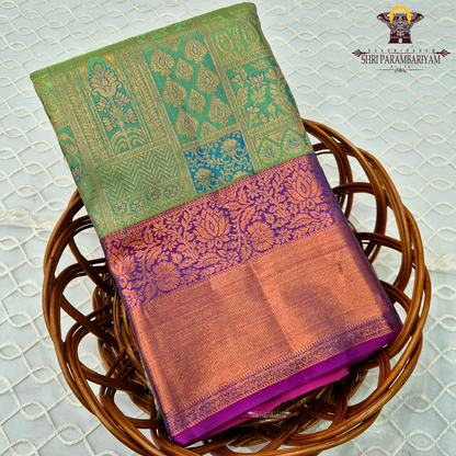 A fresh parrot green body with a contrasting rich purple border and pallu Saree
