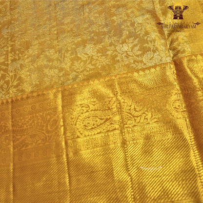A rich antique gold shade that radiates elegance and traditional charm Saree