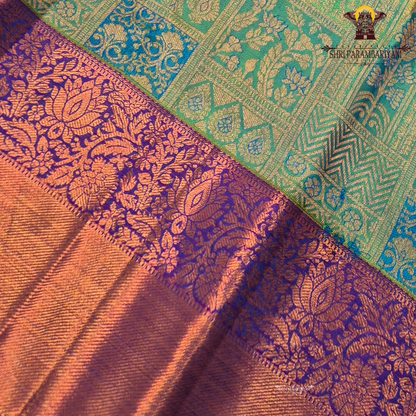 A fresh parrot green body with a contrasting rich purple border and pallu Saree