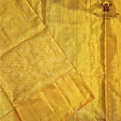 A rich antique gold shade that radiates elegance and traditional charm Saree