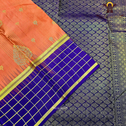 A striking reddish-orange (rust orange) Saree