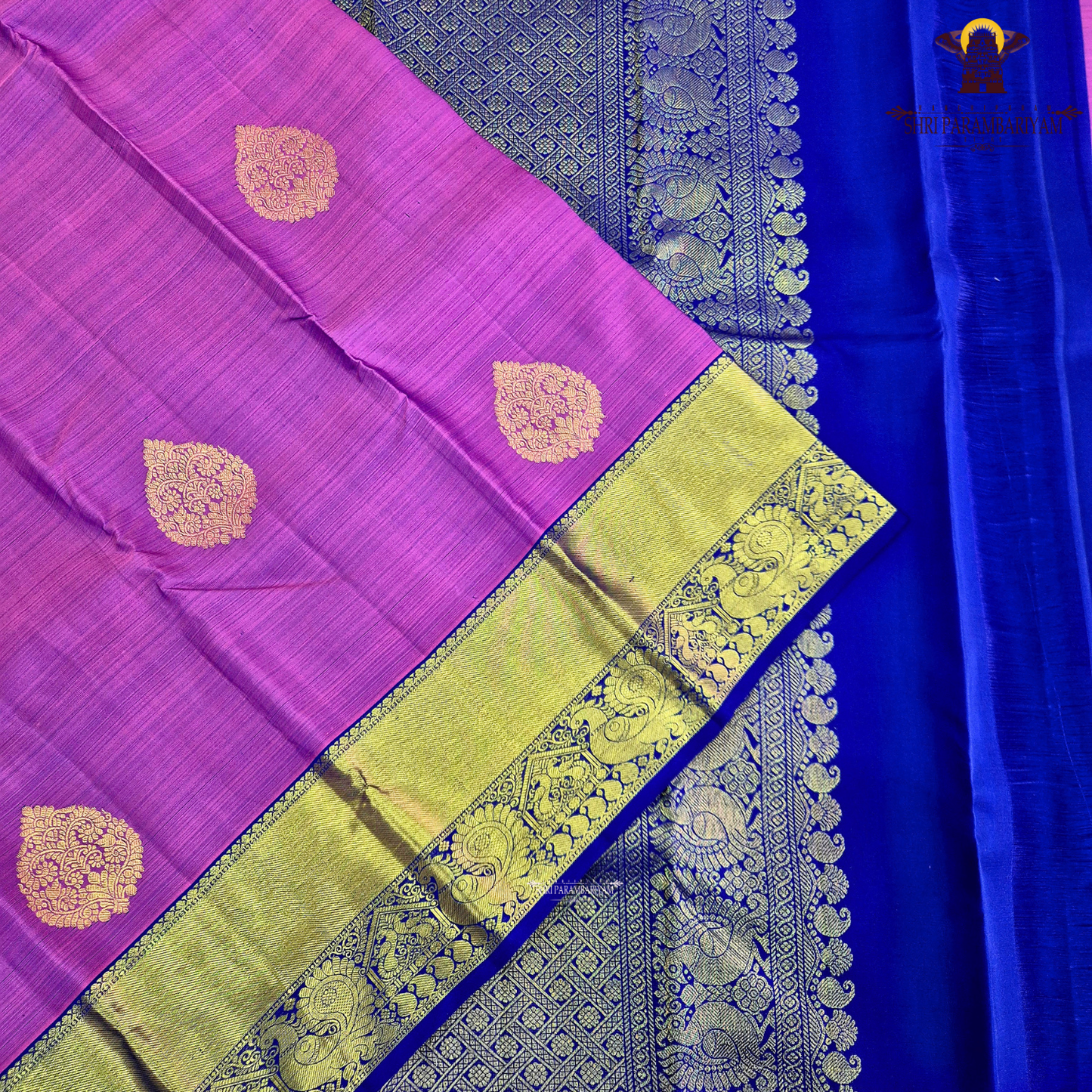 A vibrant magenta purple shade, featuring elegant zari Saree