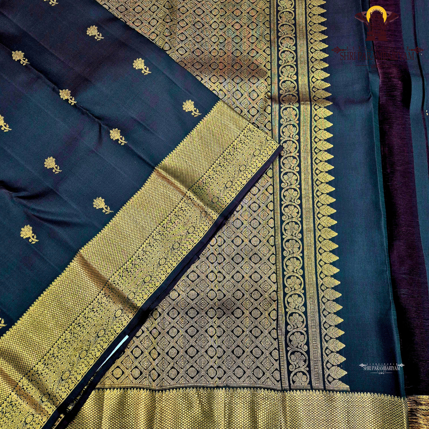A classic Dark Bottle Green with rich Gold zari Saree