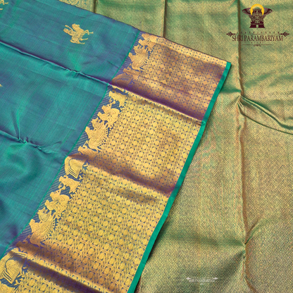 A elegant Dual-tone Teal Green with Royal Blue and Antique Gold Zari Saree
