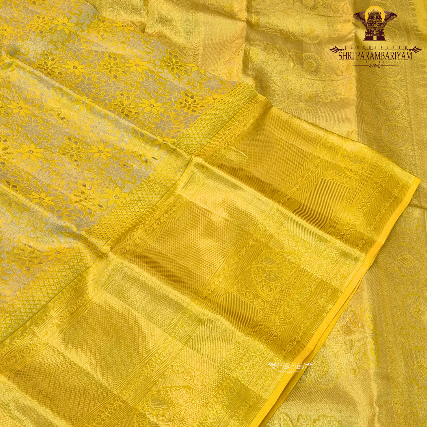 A vibrant bright golden yellow shade that radiates traditional elegance and festive Saree