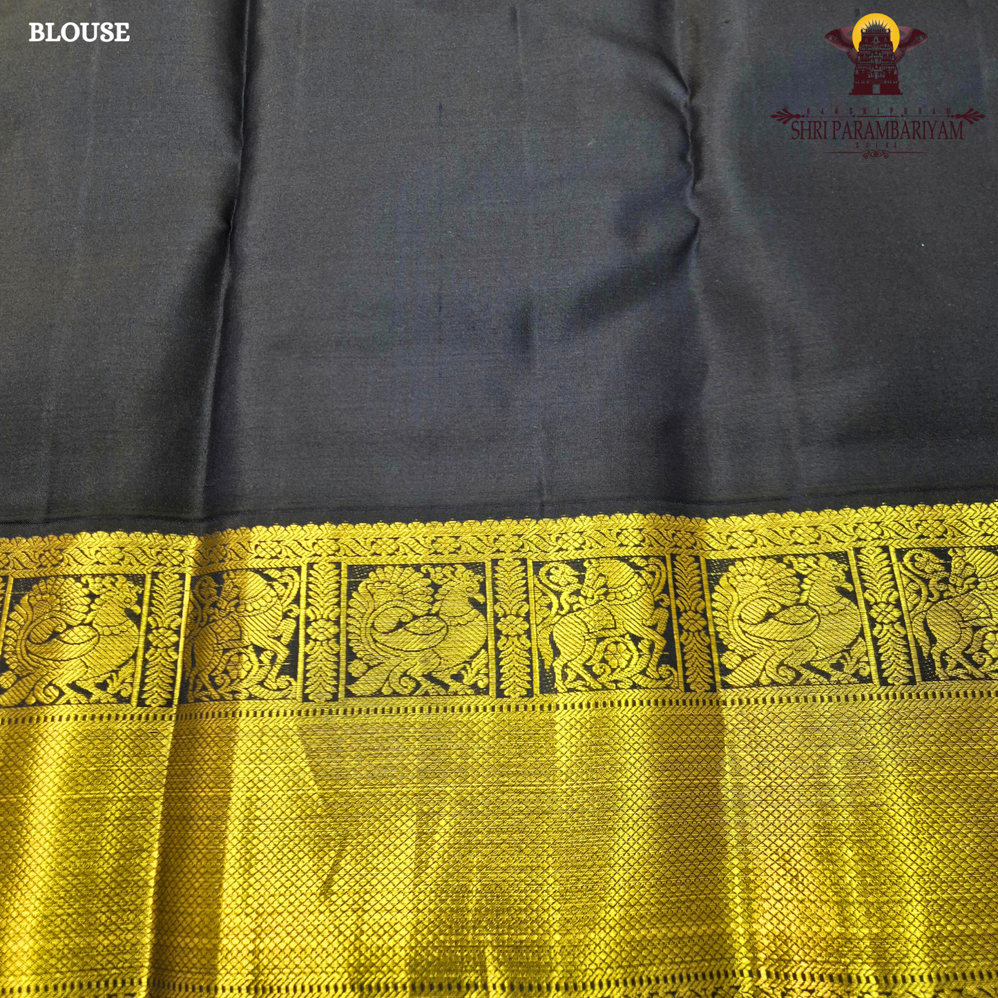 A bright turmeric yellow body paired with a deep navy blue border richly woven Saree