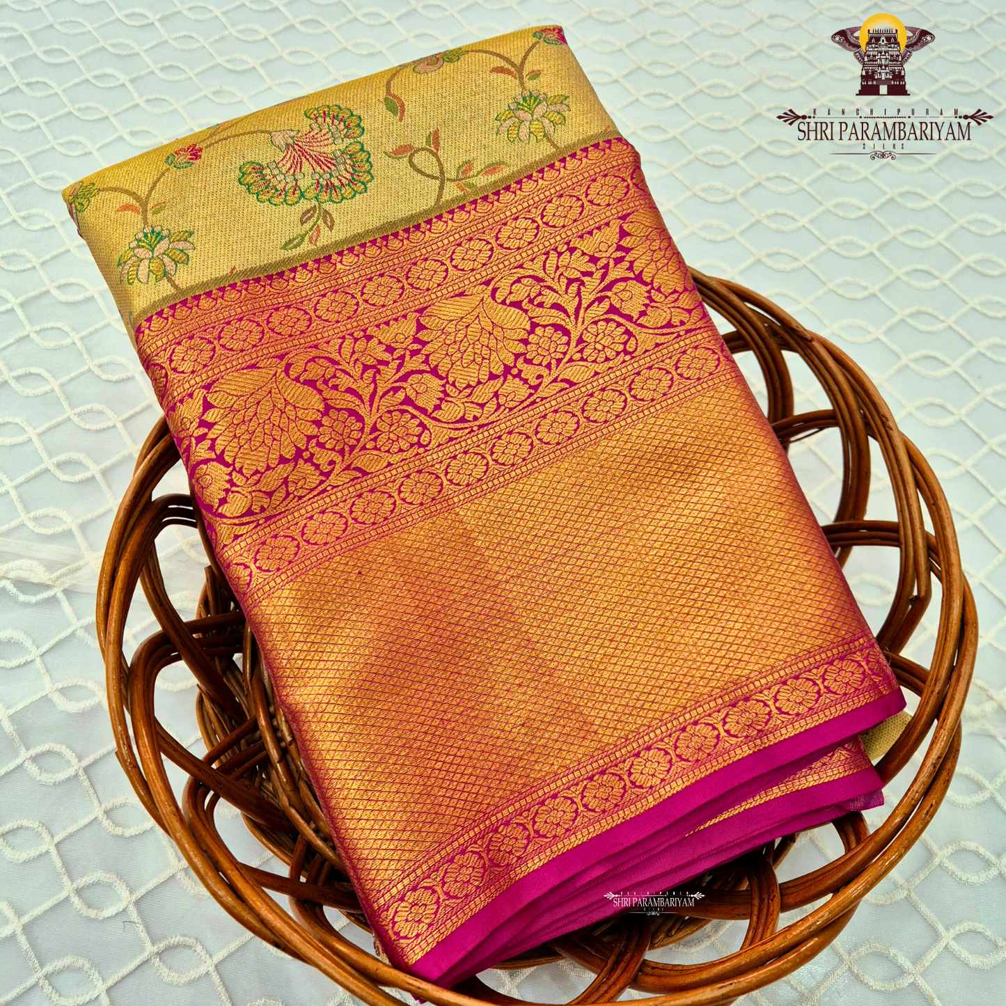 A rich golden tissue body with a vibrant rani pink (magenta) border Saree