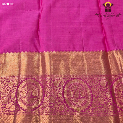 A rich dual-tone combination with a deep teal green body, contrasted Saree