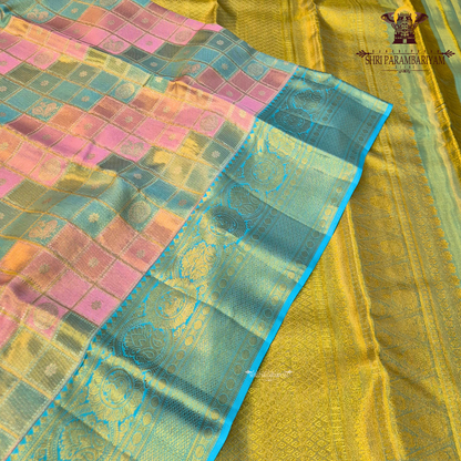 A beautiful blend of pastel multicolor shades featuring soft pink, peach, and mint green checks on the body, paired with a rich turquoise blue border Saree