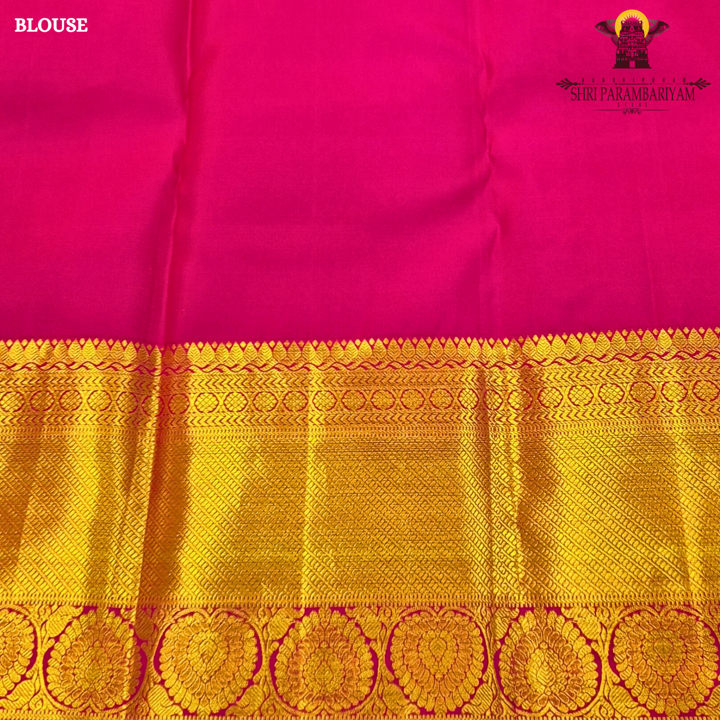 A bright turquoise blue body paired with a rich magenta pink border intricately woven Saree