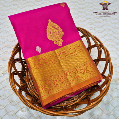 Rani Pink (Deep Magenta Pink) body with a rich Gold Zari border and an Orange-gold selvedge (edge finish) Saree