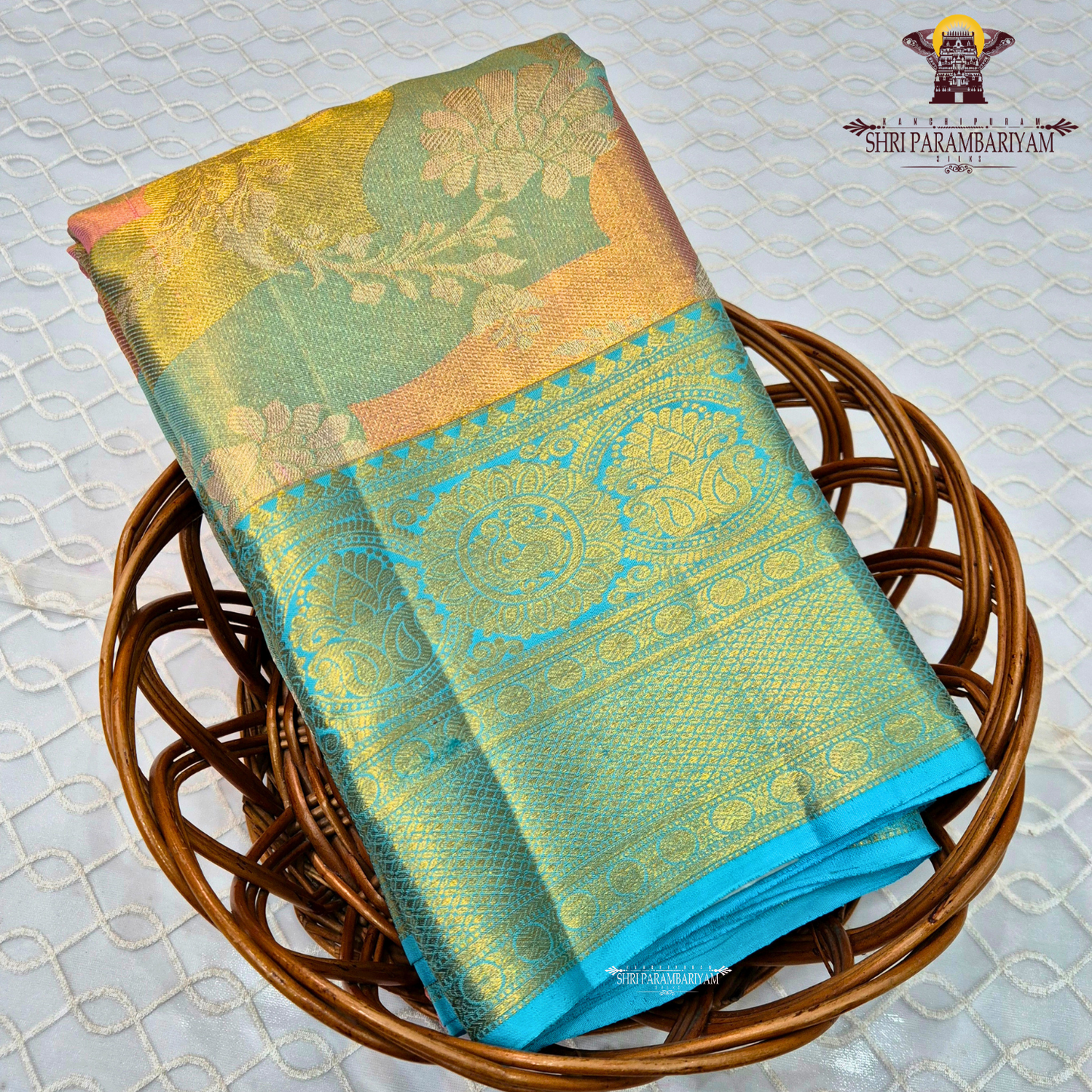 A rich dual-tone combination featuring golden tissue with pastel mint green Saree