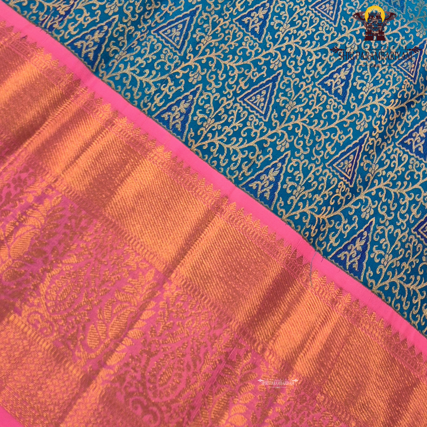 A vibrant peacock blue body paired with a bright pink korvai border Saree