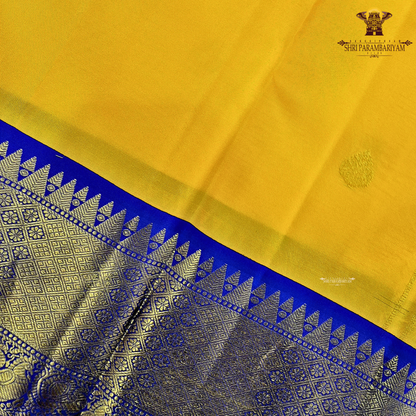 A radiant turmeric yellow body adorned with elegant zari buttas Saree