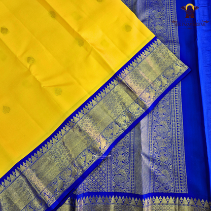 A radiant turmeric yellow body adorned with elegant zari buttas Saree