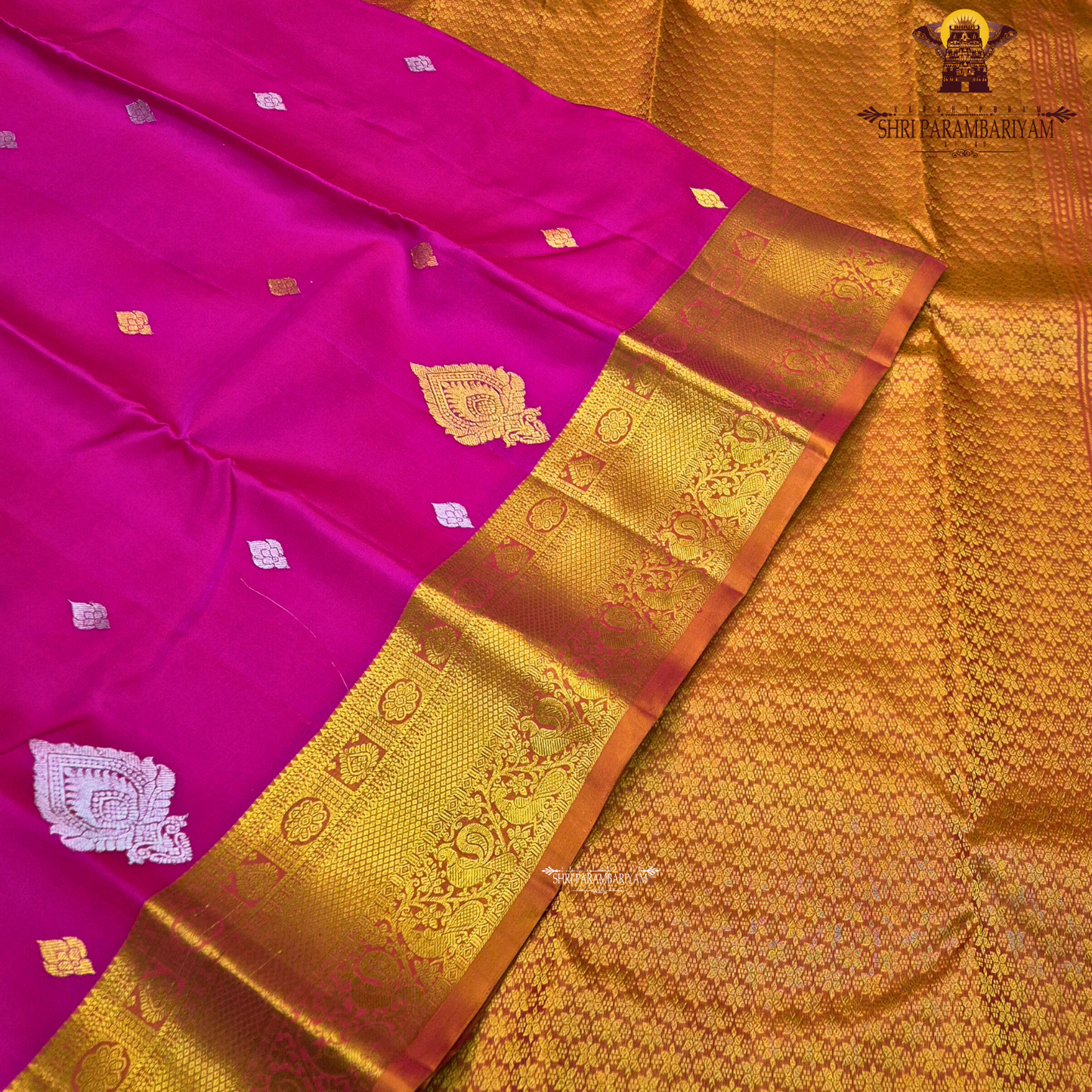 Rani Pink (Deep Magenta Pink) body with a rich Gold Zari border and an Orange-gold selvedge (edge finish) Saree