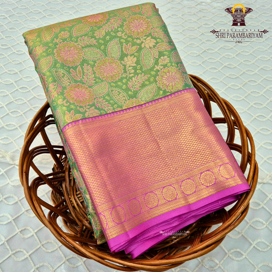 A beautiful leaf green base with pink with magenta-pink border Saree