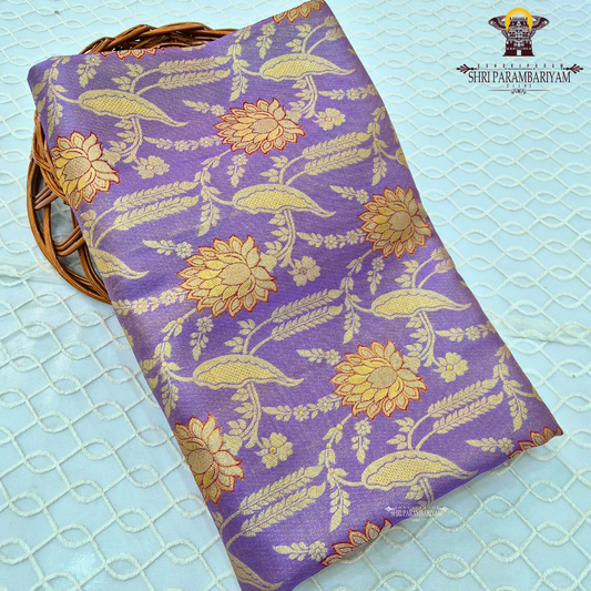 A graceful lavender / soft purple base highlighted with rich golden zari Saree