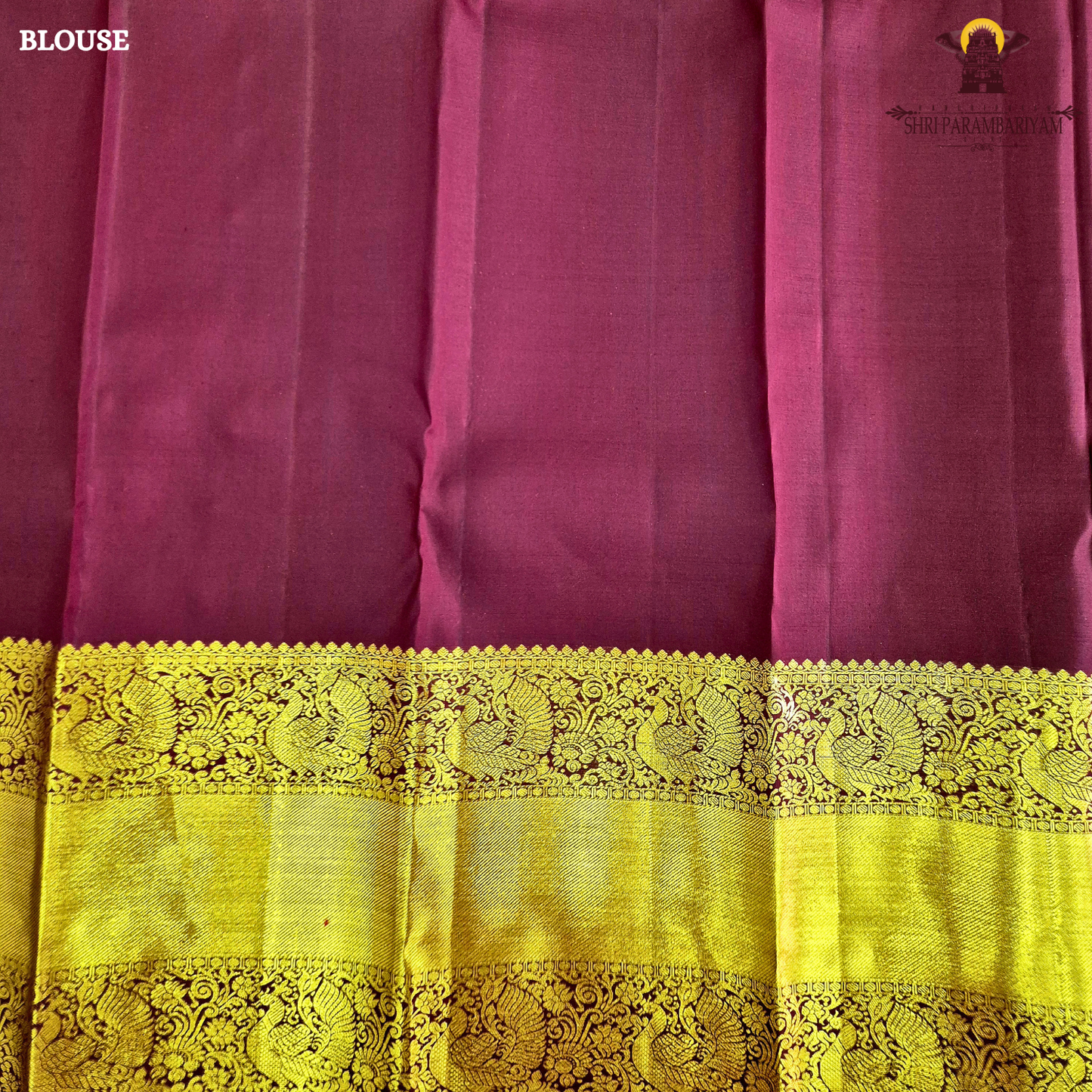 A parrot Green with Rich Gold Zari and Maroon Contrast Border Saree