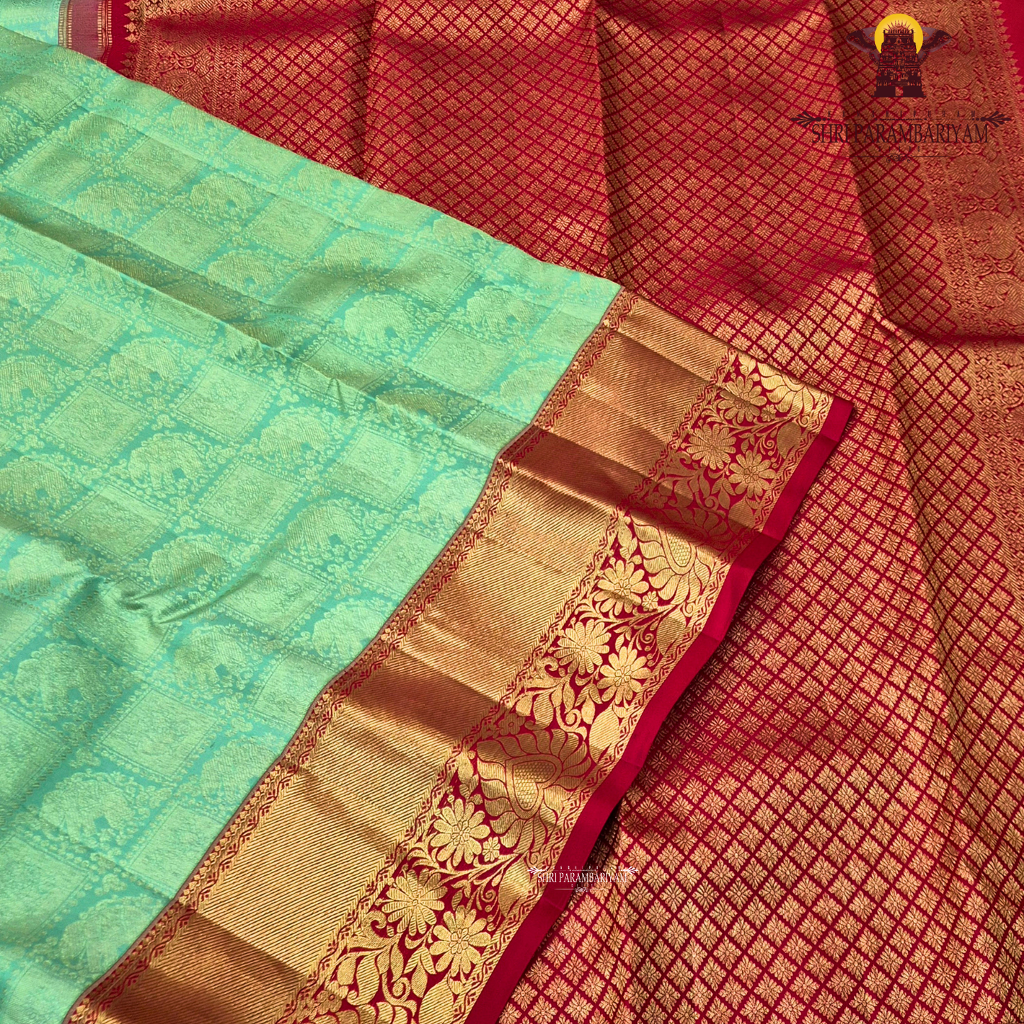 A Mint green with a rich red korvai border and elegant gold zari Saree