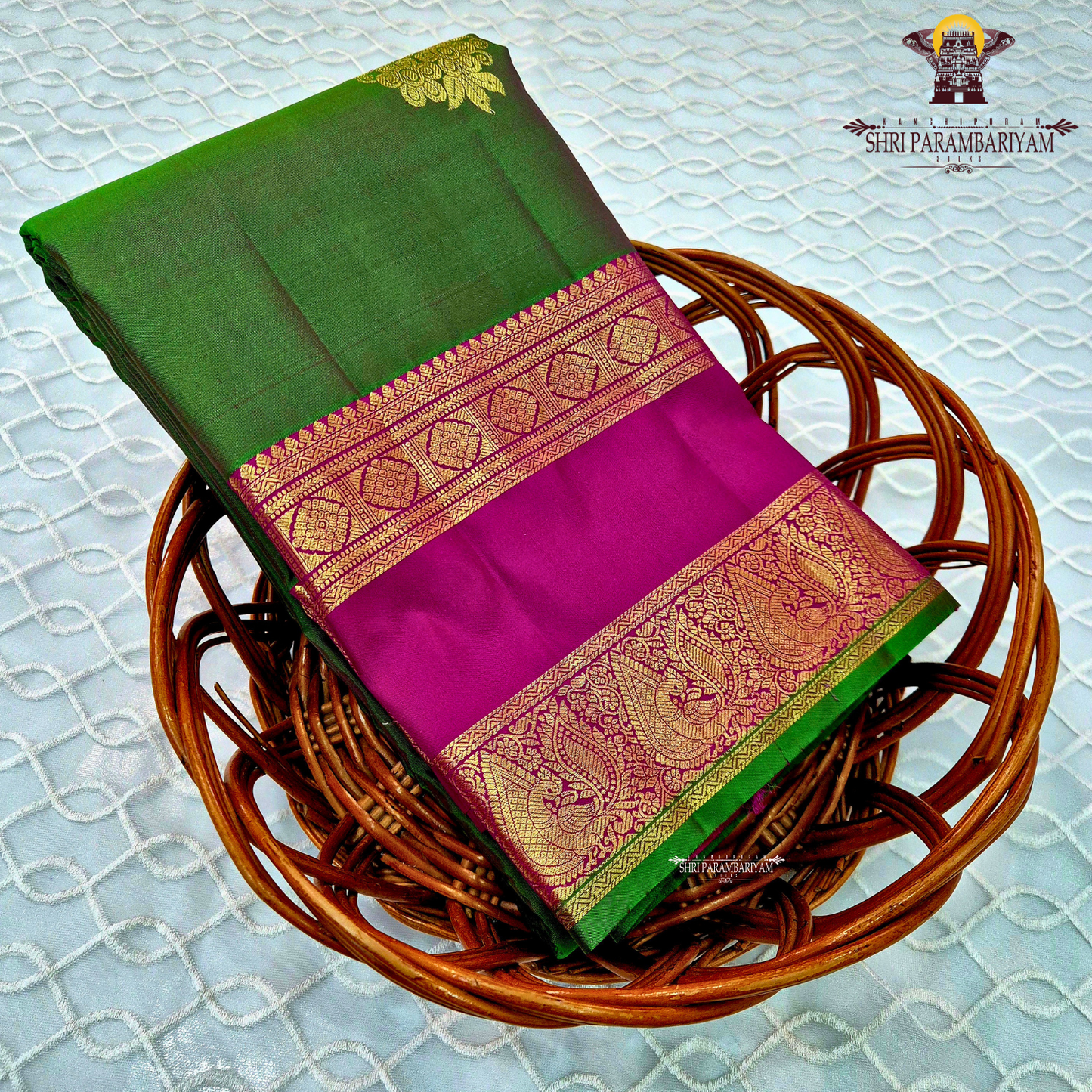 A elegant Bottle Green with Rani Pink contrast and rich Gold zari work Saree