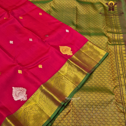 Vermillion Red body with rich Gold zari border and contrast Green edge Saree