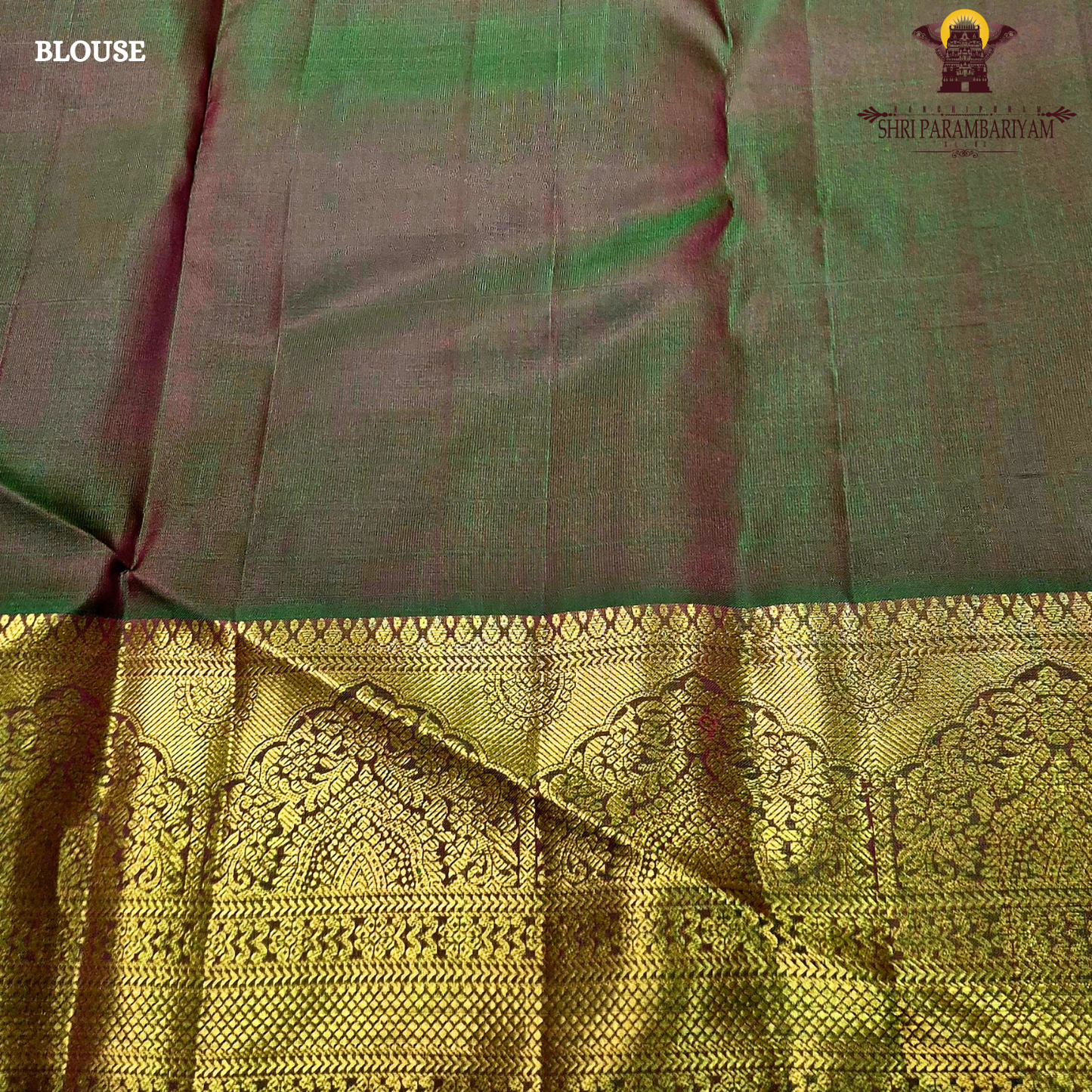 Vermillion Red body with rich Gold zari border and contrast Green edge Saree