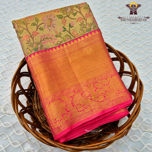 A graceful golden beige / antique gold base with multicolor floral Saree