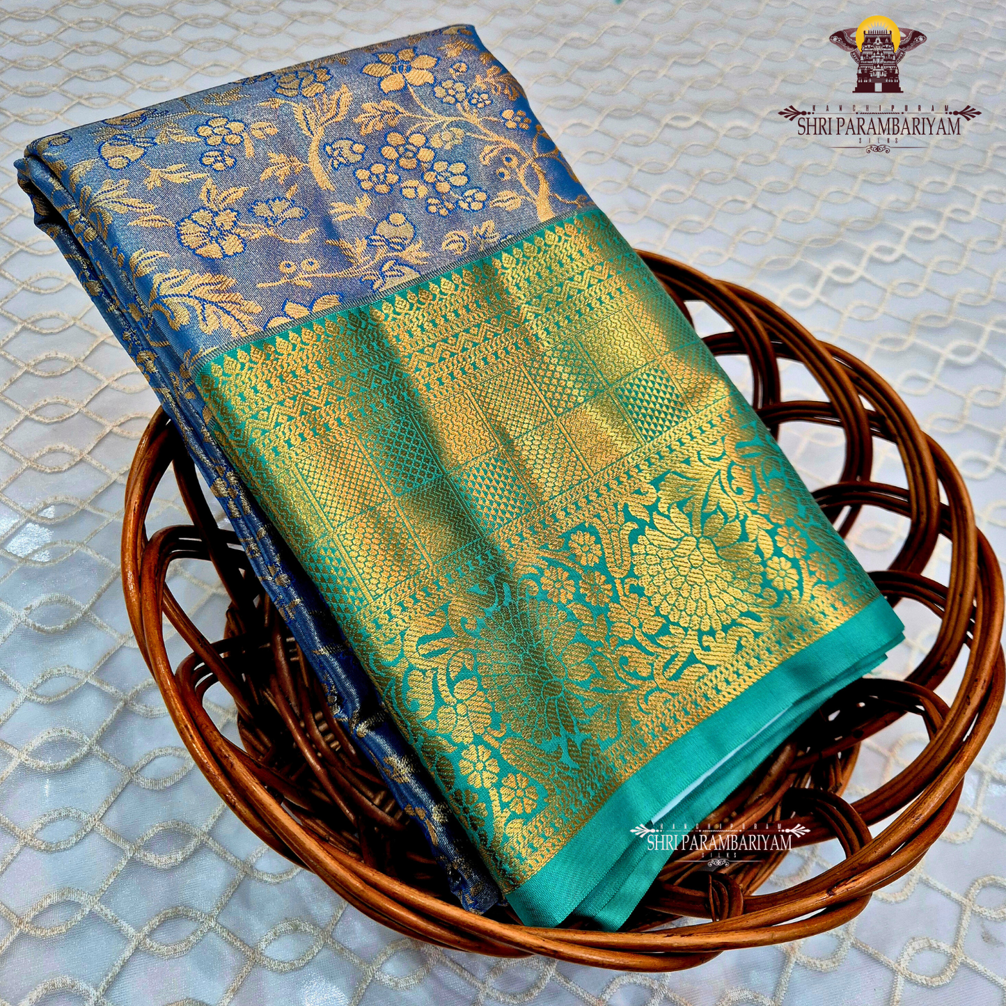 An elegant steel blue / peacock blue Tissue Saree