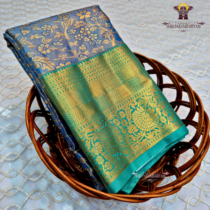 An elegant steel blue / peacock blue Tissue Saree