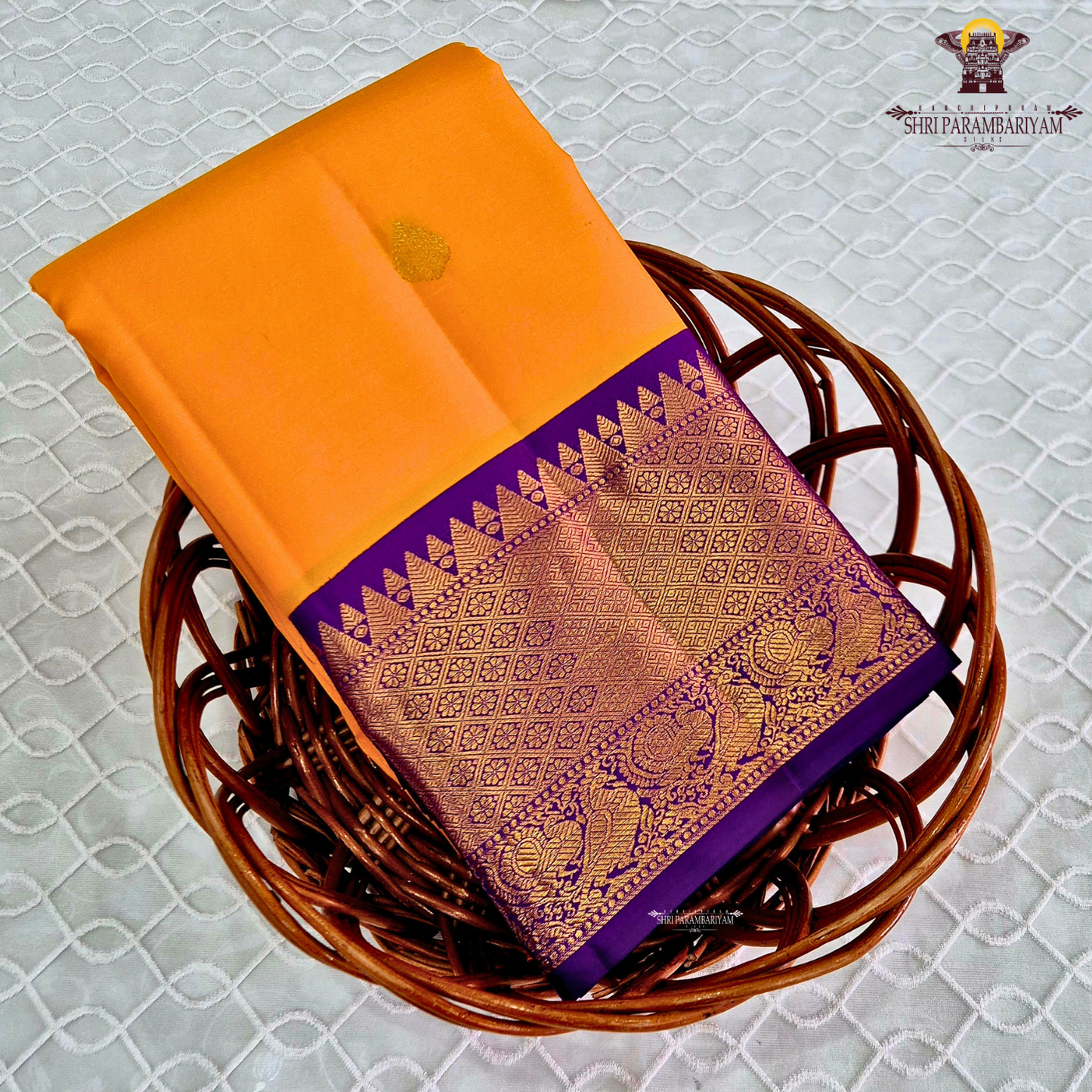 A vibrant Mango Yellow / Golden Orange body with a rich Royal Purple Korvai Border Saree