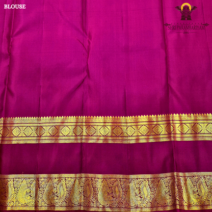 A elegant Bottle Green with Rani Pink contrast and rich Gold zari work Saree